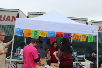 One of the vendors, screen printing shirts using hand-carved woodblocks